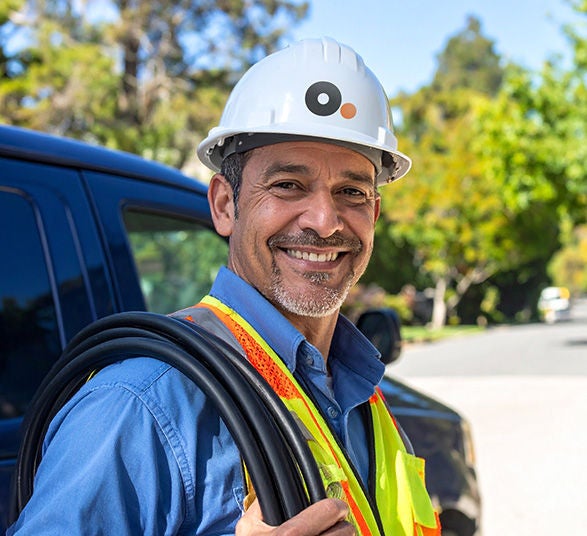 Optimum technician in uniform performing professional Fiber Internet installation
